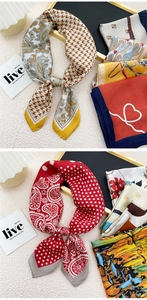 Detail of silk-feel scarves with paisley patterns, houndstooth, and red polka dots
