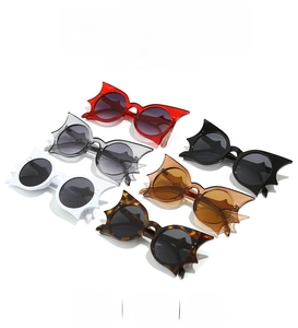 Detailed macro view showing diverse colors of bat-shaped hip-hop fashion sunglasses