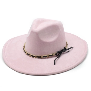 Detail of pink faux suede fedora hat with gold chain link and black bow accent