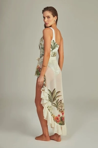 Detail of one-shoulder swimsuit with tropical palm print and ruffled chiffon sarong