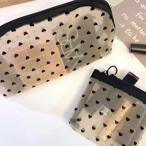 Detail of heart flocked mesh makeup bags showing two sizes with durable zippers