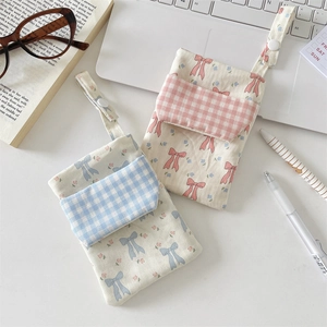 Floral nurse pouch with bow detail and snap strap for pocket organization in 2-pack