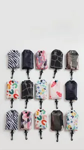 Foldable shopping bags in diverse prints with black hooks and snap closures