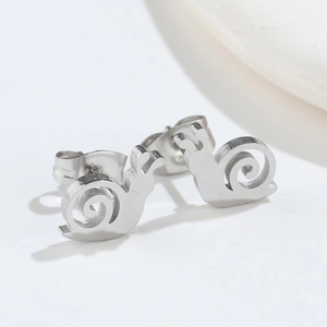 Detailed macro view of cute silver snail stud earrings made of polished stainless steel