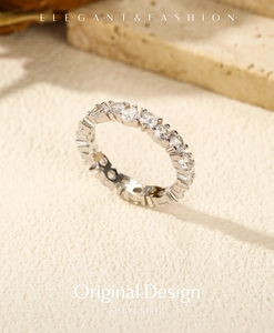 Macro shot of silver S925 sterling silver eternity ring with sparkling zircon stones