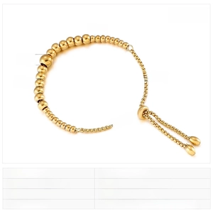 Detail view of gold adjustable bead bracelet with stainless steel size specifications