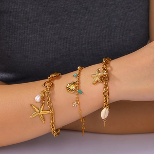 Three-piece 18k gold plated stainless steel bracelet set with starfish, shell, and pearls