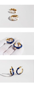 Detail of white and blue enamel C-shape hoop earrings with square zircon in gold finish