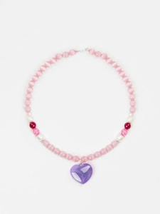 Close-up of pink cat eye bead necklace with a large purple heart pendant and lobster clasp