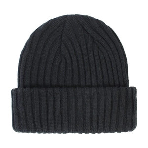Close-up of black ribbed knit beanie showing detailed texture and folded brim design