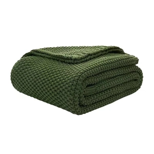Olive green chunky knit blanket with tassels in Nordic style, soft yarn throw for sofa