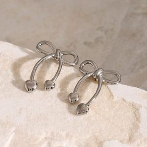 Polished silver stainless steel bow earrings with double heart charms on stone