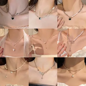 Elegant gold and silver pearl necklaces with heart and geometric pendants set