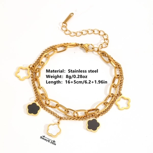 Bracciale a doppio strato in acciaio inossidabile dorato con ciondoli a fiore neri e cavi