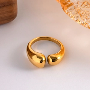 Polished gold teardrop open ring in stainless steel with a sleek fluid aesthetic design