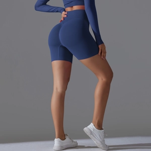 Detail view of seamless high-waisted navy yoga shorts with scrunch butt lifting texture