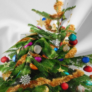 Detail of Christmas tree print on bohemian tapestry fabric with colorful ornaments