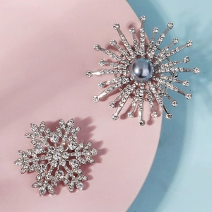 Elegant snowflake and sunburst brooches with pearls and rhinestones for party dresses