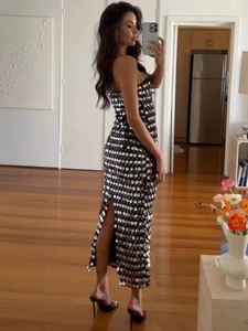 Elegant black sequin slit maxi dress with shimmering silver paillettes for formal events