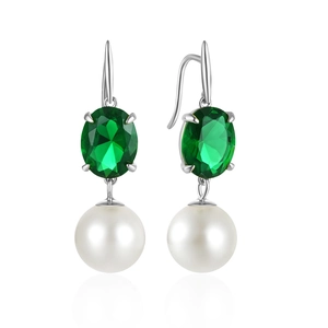 Detailed macro view of S925 silver emerald gemstone earrings with white pearls and zircon