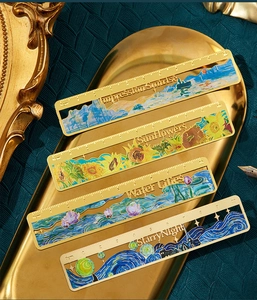 Detail of artistic metal bookmarks featuring impressionist oil painting hollow patterns