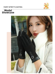 Detail of warm black suede gloves for women with metal buckle and faux leather strap detail
