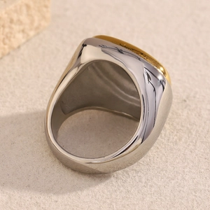 Polished two-tone stainless steel wide band ring with gold-plated rectangular plate accent