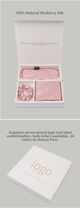 Close-up of pink mulberry silk gift set including eye mask, scrunchie and pillowcase