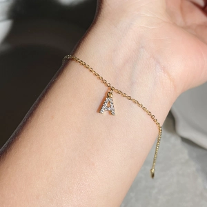 18K gold plated zircon initial A bracelet featuring a delicate link chain on wrist