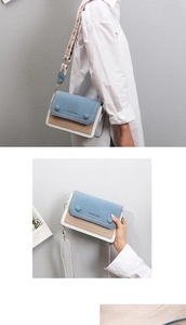 Close-up of stylish crossbody bag featuring retro embroidery wide strap and PU leather