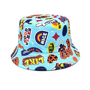 Detail of light blue reversible kids sun hat with colorful graffiti prints on cotton canvas