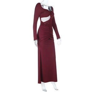 Detail of burgundy long sleeve dress with waist cut-out and elegant pleated texture