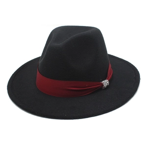 Classic black wide-brim wool fedora hat with a red ribbon and rhinestone buckle detail