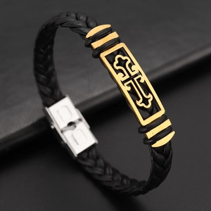 Men's braided leather bracelet with golden cross plate and silver clasp on black background