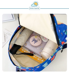 Detailed interior view of the blue dinosaur backpack showing large storage capacity
