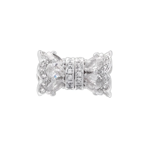 Detail of silver bow-shaped charm bead with cubic zirconia for DIY jewelry making