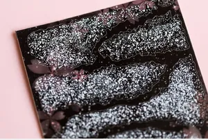 Detailed macro view of 5D cherry blossom nail stickers with matte pink floral texture