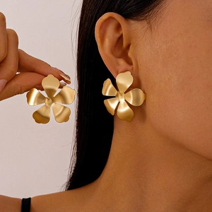 Matte gold oversized metallic flower earrings with five-petal design for a modern look