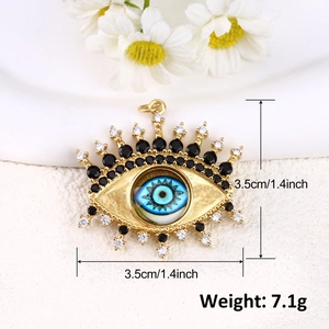 Detailed size view of a 3.5cm gold-plated evil eye pendant with blue zircon stones