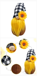 Detail view of gnome plush doll with yellow beard, plaid hat, and sunflower decoration