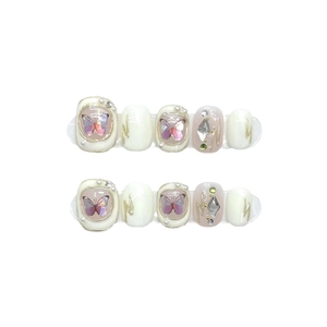 Baroque press-on nails with butterflies pearls and rhinestones on short round oval tips