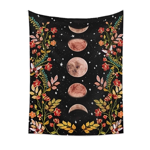 Detail view of lunar phase tapestry with floral patterns and butterflies on black fabric