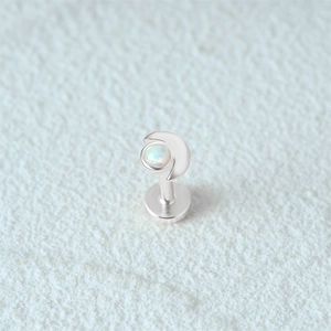 Macro view of s925 silver moon stud earring with white opal and flat back design