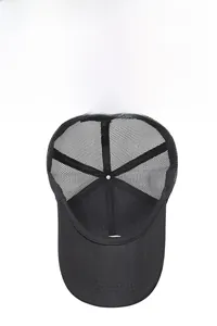 Detail of black breathable mesh on a quick-dry trucker hat with reinforced stitching
