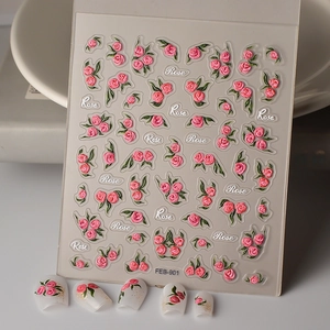 Detailed 5D embossed nail stickers featuring pink roses and green leaves on white tips