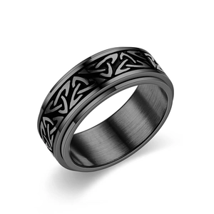 Men's black matte titanium steel spinner ring featuring Celtic knot design carvings