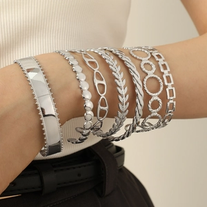 Modern 6-piece silver wheat and pig nose geometric bracelet set on female wrist