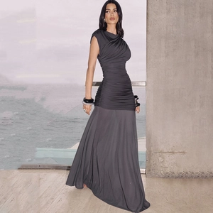 Detail of the elegant ruched bodice and flowing skirt of this grey sleeveless maxi dress