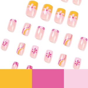 Pink and yellow floral french tip press-on nails with wave pattern set on white background