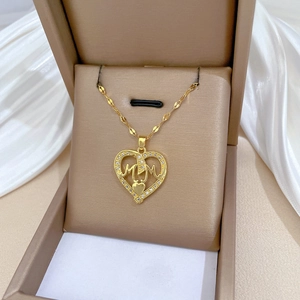 Gold plated heart pendant necklace with MOM lettering and diamonds in a jewelry box